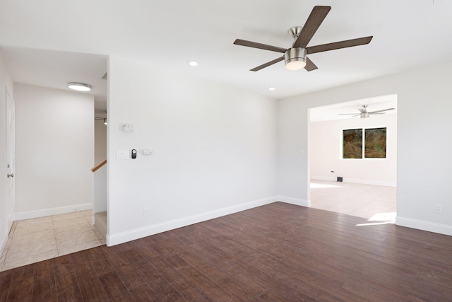 spare room with ceiling fan and light hardwood / wood-style flooring