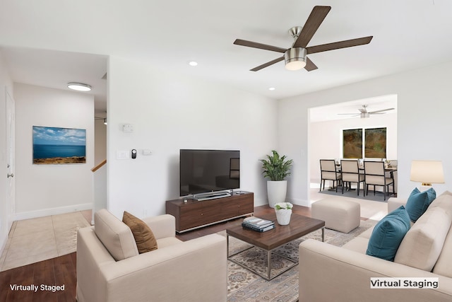 living room featuring ceiling fan