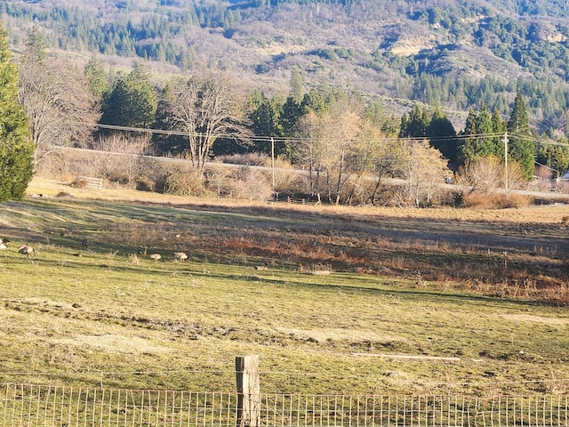 view of mountain feature with a rural view