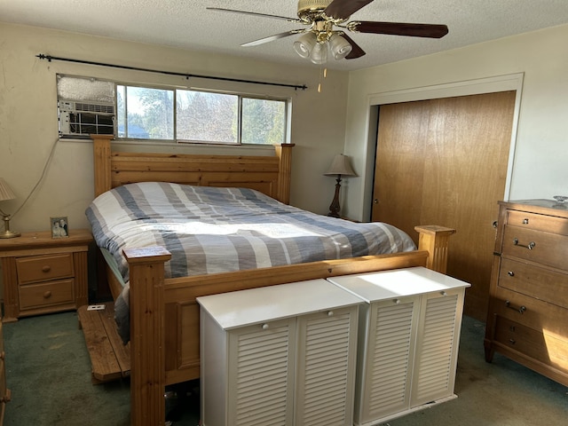 bedroom with ceiling fan, dark carpet, a closet, and a textured ceiling