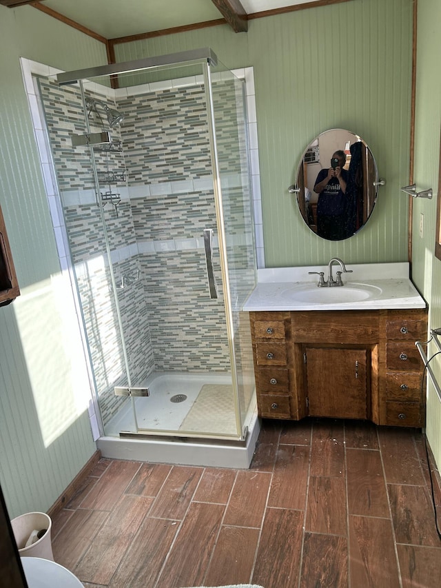 bathroom featuring vanity and a shower with shower door