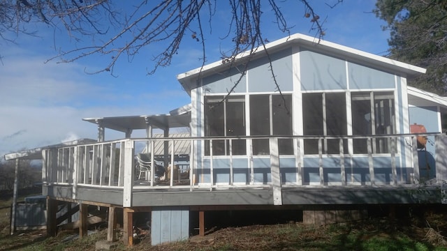 back of property featuring a sunroom