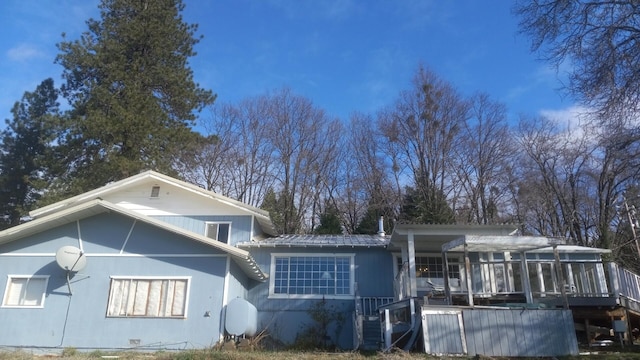 rear view of property with a deck