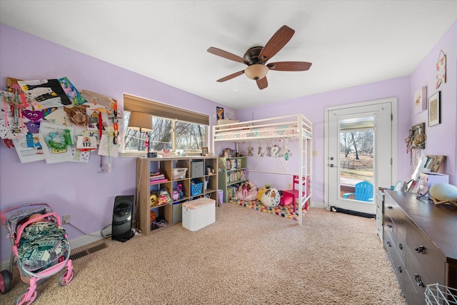 carpeted bedroom with multiple windows, access to outside, and ceiling fan