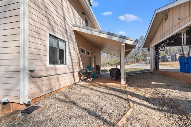 view of side of home featuring a patio