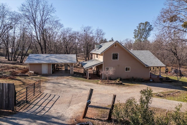 view of front of home featuring a carport