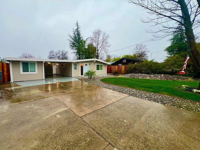 ranch-style house with a front lawn