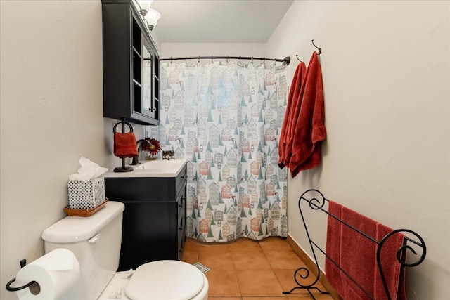 bathroom featuring tile patterned floors, toilet, and vanity