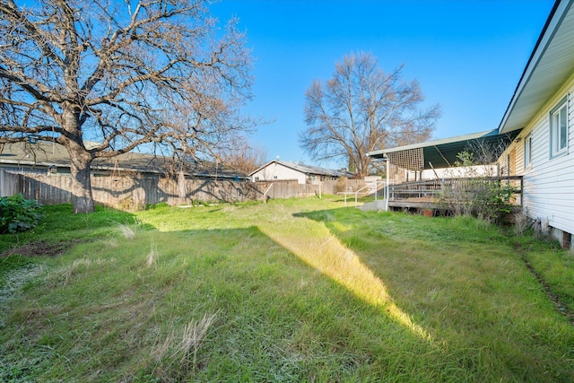 view of yard featuring a wooden deck