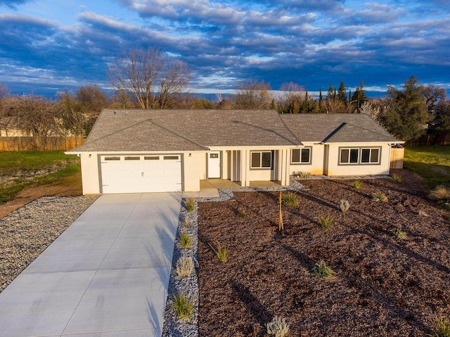 single story home with a garage