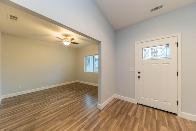 entrance foyer with ceiling fan, lofted ceiling, and dark hardwood / wood-style floors