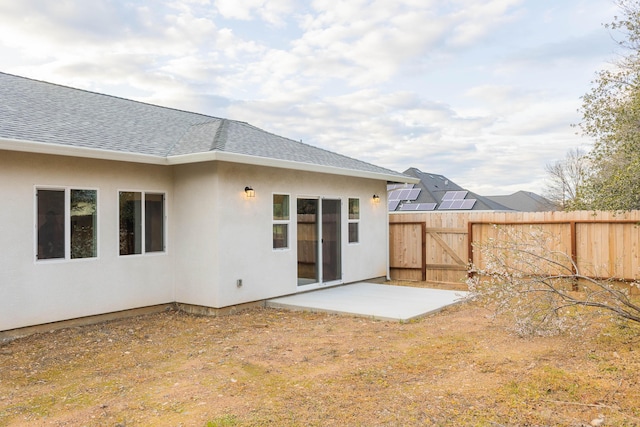 rear view of house with a patio