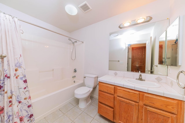 full bathroom with shower / bath combo with shower curtain, tile patterned floors, toilet, and vanity