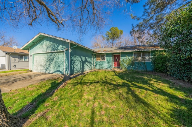 ranch-style home with a garage and a front yard