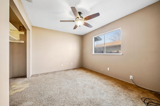 unfurnished bedroom featuring carpet, ceiling fan, and a closet