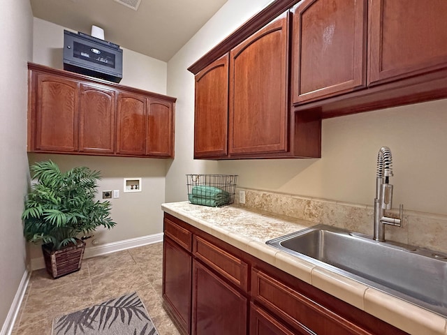 kitchen featuring tile counters and sink