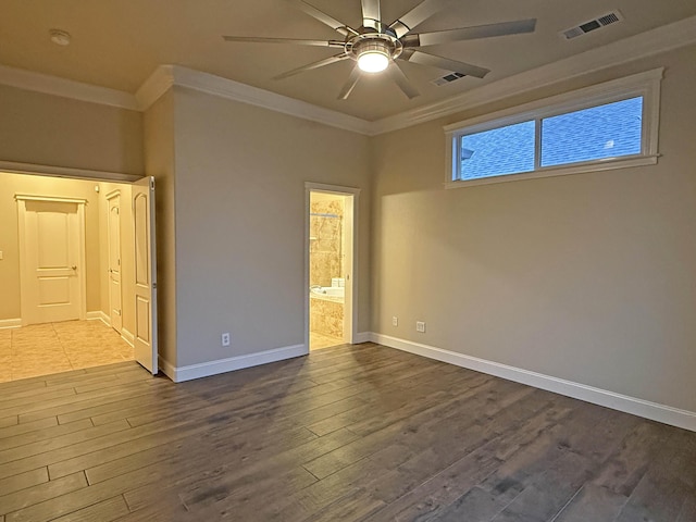 spare room with hardwood / wood-style flooring, crown molding, and ceiling fan