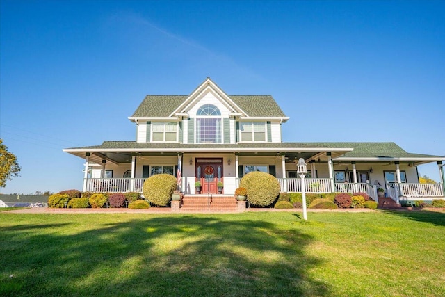 farmhouse featuring covered porch and a front lawn