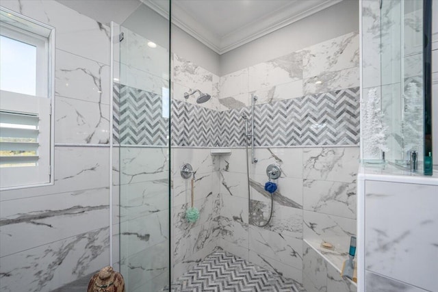 bathroom featuring ornamental molding and a tile shower