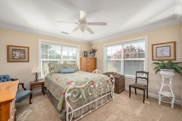 carpeted bedroom featuring ornamental molding and ceiling fan