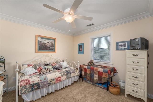 carpeted bedroom featuring ornamental molding and ceiling fan