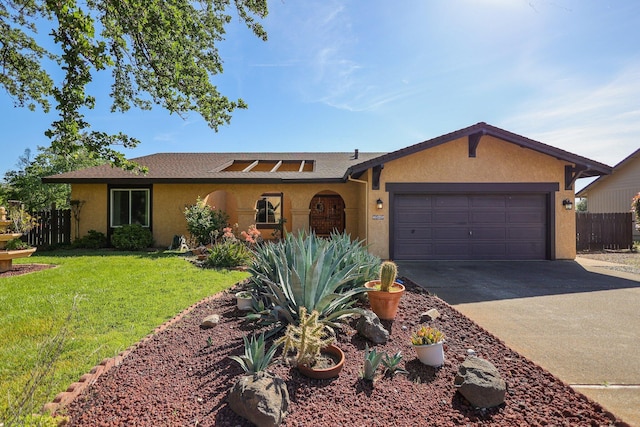 ranch-style home featuring a garage and a front lawn