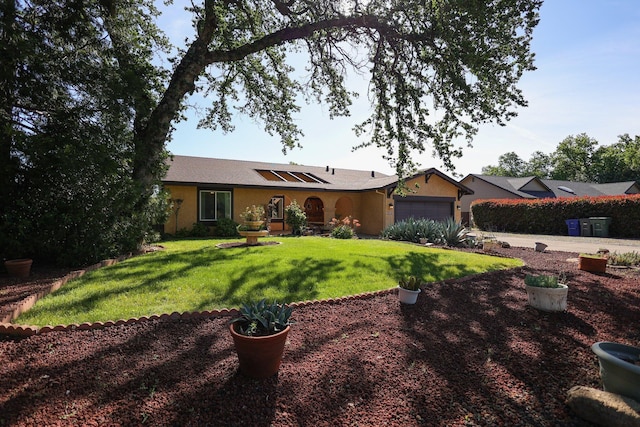 ranch-style house with a garage and a front lawn