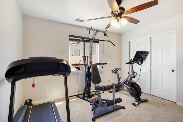 exercise room with carpet floors and ceiling fan