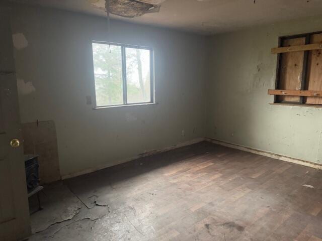 unfurnished room featuring hardwood / wood-style flooring