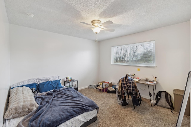 bedroom with carpet, a textured ceiling, and ceiling fan