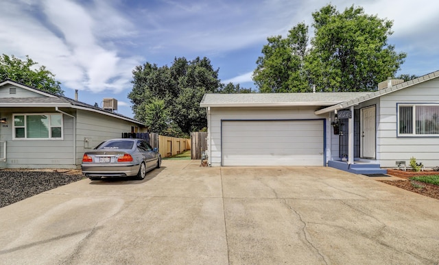 2548 Saturn, Redding, CA 96002 - view of front of home featuring concrete driveway, fence, and an attached garage