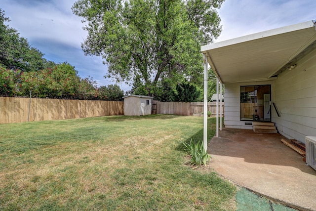 2548 Saturn, Redding, CA 96002 - view of yard featuring a storage unit, an outbuilding, and a patio area