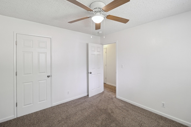 2548 Saturn, Redding, CA 96002 - unfurnished bedroom featuring carpet floors, a textured ceiling, baseboards, and ceiling fan