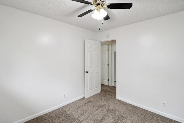 2548 Saturn, Redding, CA 96002 - carpeted empty room with baseboards, a ceiling fan, a textured ceiling, and a heating unit