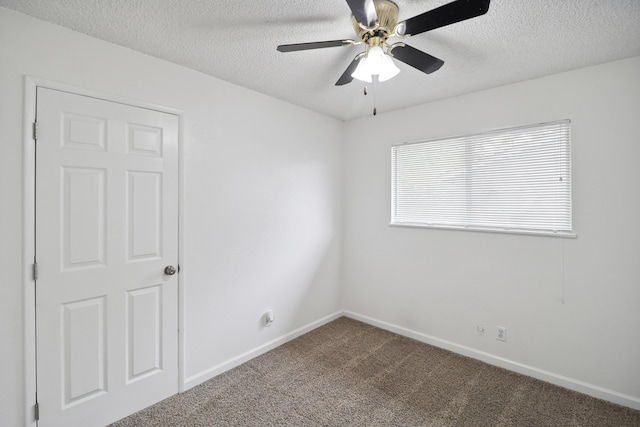 2548 Saturn, Redding, CA 96002 - empty room featuring carpet floors, a textured ceiling, ceiling fan, and baseboards