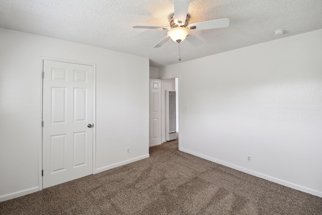 2548 Saturn, Redding, CA 96002 - unfurnished bedroom featuring carpet floors, a textured ceiling, baseboards, and ceiling fan