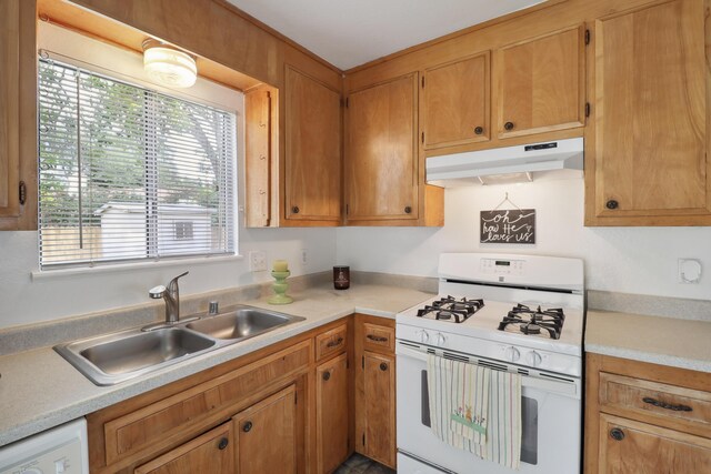 2548 Saturn, Redding, CA 96002 - kitchen featuring white appliances, under cabinet range hood, a sink, and healthy amount of natural light