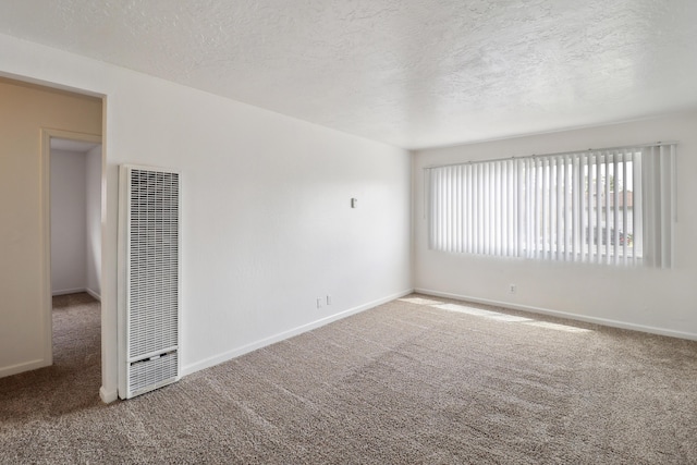 2548 Saturn, Redding, CA 96002 - carpeted empty room featuring a heating unit, a textured ceiling, and baseboards
