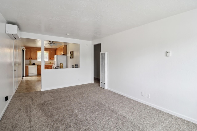 2548 Saturn, Redding, CA 96002 - unfurnished living room with a wall mounted AC, light carpet, a heating unit, and baseboards
