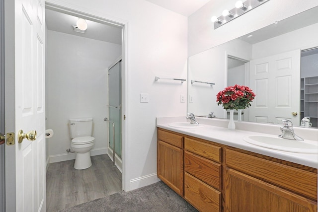 bathroom with vanity, toilet, and walk in shower