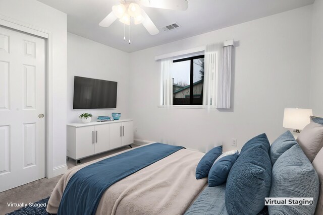 bedroom with ceiling fan and light colored carpet