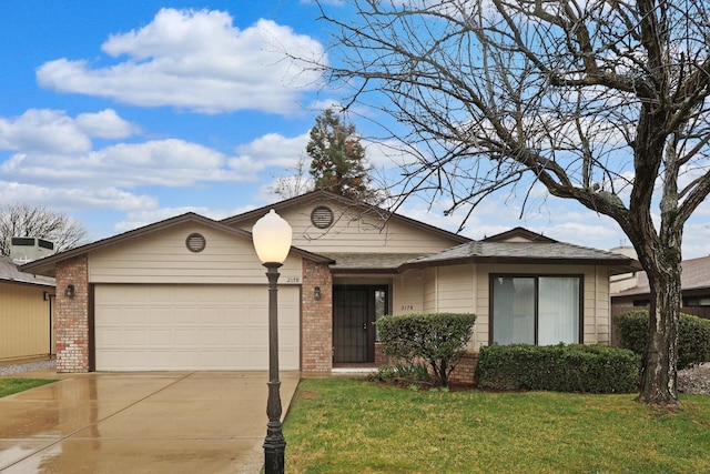 single story home with a garage and a front yard