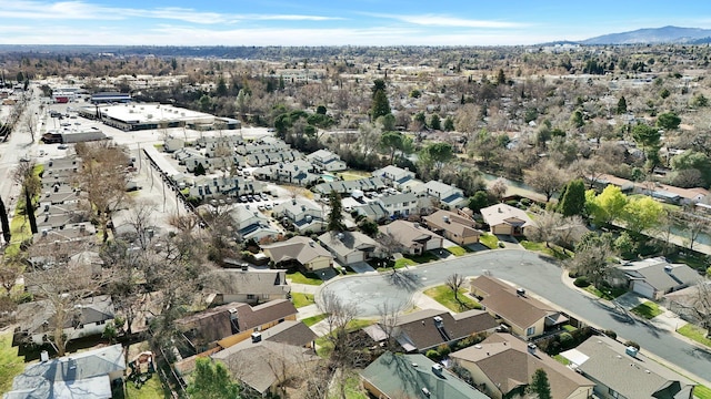 birds eye view of property featuring a mountain view