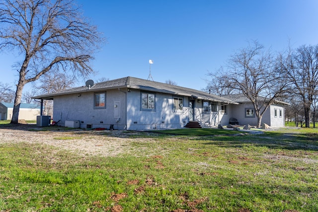 view of front of house with crawl space, a front lawn, and central air condition unit