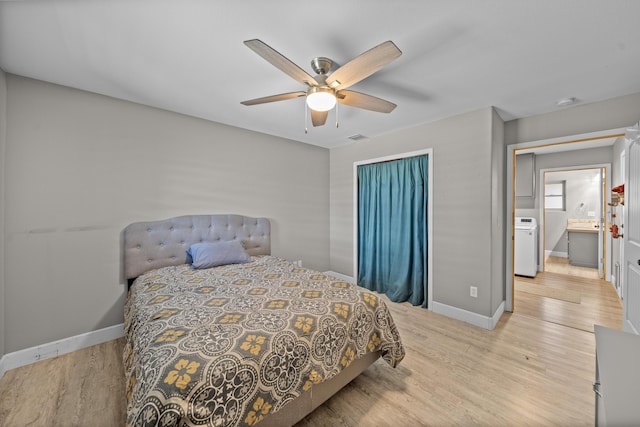 bedroom featuring visible vents, light wood-style flooring, and baseboards