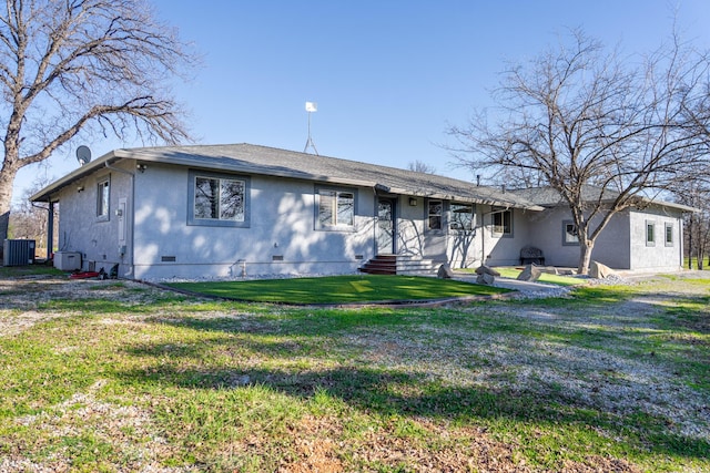 single story home with crawl space, a front lawn, and central air condition unit