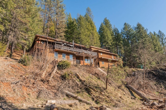 rear view of property with a deck