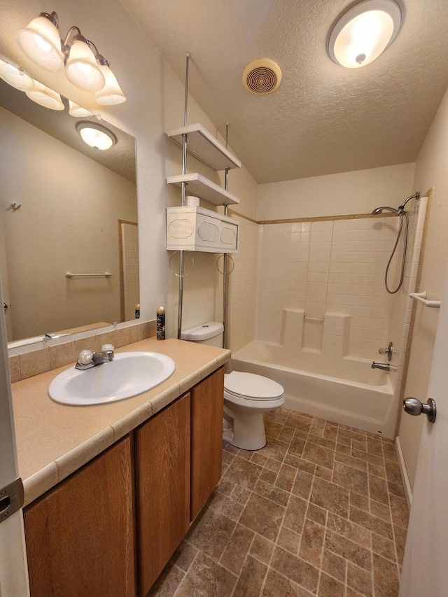 full bathroom featuring shower / tub combination, vanity, a textured ceiling, and toilet