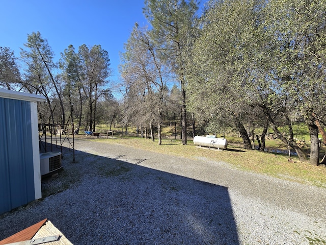 view of yard featuring central AC unit