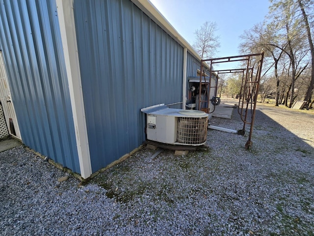 view of side of property with cooling unit